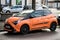 Front view of Orange Toyota Yaris parked in the street