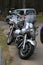 Front view of parked motorcycles Yamaha XV 1700 Road Star Silverado and Kawasaki Vulcan VN 1500 in cloudy day