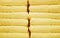 Front View of Pastel Butter Yellow Fluffy Towels Stack