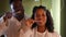 Front view positive African American young family brushing teeth looking at camera. Portrait of confident man and woman