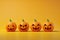 front view pumpkins with orange background generative ai