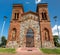 Front view of rectangular plan, two-tower church with Neo-Gothic features of the Romantic period fence stone masonry