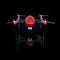 Front view of red drone isolated on black background