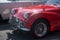 Front view of red retro triumph car parked in the street