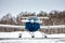 Front view of the shrouded small sports airplane at the winter airfield