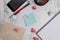 Front view smartphone hard cover notebook paper sheet ball ballpoint envelope sticky note colored clips holder binders