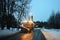 Front view of snowplow service truck - gritter car spreading salt on the road. Maintenance of roads in winter in the mountains