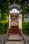 Front view of a steel vintage traditional phone booth made into a small public library in Stockholm Sweden.