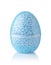 Front view of transparent egg container of blue modelling foam beads