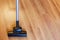 Front view vacuuming of laminate by vacuum cleaner