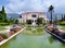 Front view of villa Rothschild with its garden, fountains and lawn, France