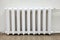 Front view white iron radiator central heating is in room