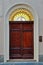 Front view of the wooden door in the archway