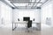 Front view on work place table with modern computer, dark chair on light concrete floor in spacious sunlit office with city view