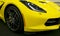 Front view of a yellow Chevrolet Corvette Z06. Car exterior details.