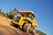 Front view of yellow tipper truck