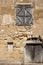 Front wall of an old stone house in Saint Emilion. France.