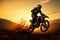 Front wheel lifted, motocross silhouette embodies adventure and daring action