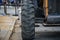 Front wheel of a wheeled tractor standing on the road. Street renovation