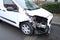 Front of white car damaged by road accident, close-up, traffic violation concept, drunk driver, vehicle repair