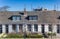 Front of white houses at the harbor of Harlingen