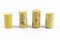 Front wide shot of multiple wine corks with blurry white background