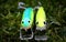 Frontal detail of two home-made fishing lures plugs minnows