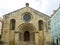 frontal facade with vaulted arch of the church of SÃ£o Tiago in the city of Coimbra.