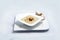 Frontal Hero Shot of a Mushroom Soup with bread crumbs, oregano on a minimal white background with a 45 degree angle