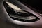 frontal view advanced xenon head-lights of Tesla car model Y in liquid silver, Mercury Silver Metallic color, popular passenger