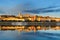 Frontal view of Buda side of Budapest city reflecting in still water of Danube river