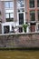 Fronts of Dutch houses - Boats tour through the canals in the Grachtengordel-West area of Amsterdam, Holland, Netherlands