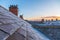 Frost covered roofs and chimneys and sunrise