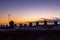 Frost covered roofs and chimneys and sunrise