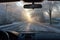 frost-covered windshield with defroster lines melting ice