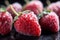 Frost kissed strawberries in close up, a winters frozen delicacy