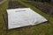 Frost protection of vegetables. the gardener covered the white breathable foil bed. frost does not burn plants and water does not