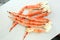 frosted Alaska king crab legs closeup photo on white table background