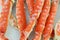 frosted Alaska king crab legs closeup photo on white table background