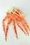 frosted Alaska king crab legs closeup photo on white table background