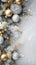Frosted Christmas ornaments and pine branches on grey background