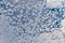 Frosted glass closeup with bright crystals, winter background. Frost on window