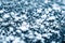 Frosting macro. Cold snow winter background. Blue crystal frozen abstract pattern. White frost ice texture.