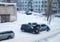 Frosts in Siberian town Novosibirsk. Technical service is trying to warm up and start the frozen car