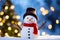 Frosty Delight, Snowman, Christmas Tree, and Bokeh Background, AI Generated