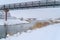 Frosty lake with bridges at Daybreak in December