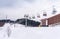 Frosty morning at the ski resort Bukovel. Ski slope and wooden cottages