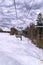 Frosty morning at the ski resort Bukovel. Ski slope and wooden cottages