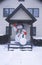 Frosty the snowman after winter snow in New Jersey during Christmas celebration in front doorway of home