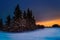 Frosty, snowy night with a purple sky, Christmas tree at night